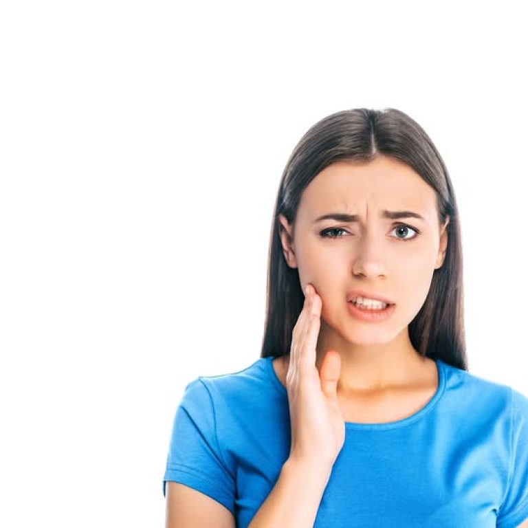 portrait of young woman having toothache isolated on white